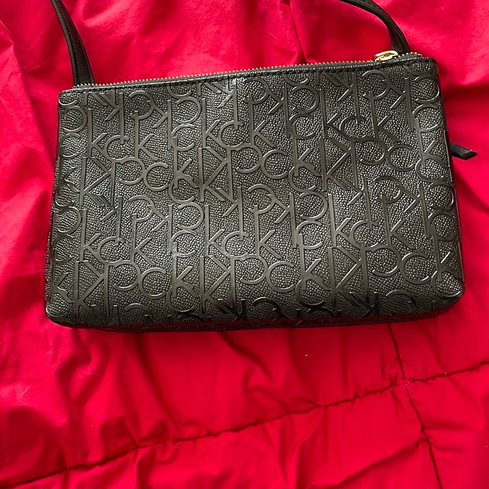 Calvin Klein cross body black dual pocket bag